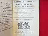an open book with a picture of a bird on it