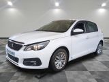 the white car is parked on a checkered tile floor