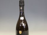 the bottle of champagne is sitting on the table