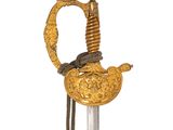 an image of a sword with a gold decoration on it