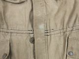 a close up of a jacket with buttons on it