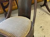 a chair that is sitting in front of a table