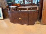 a large wooden tub sitting on the floor in a room