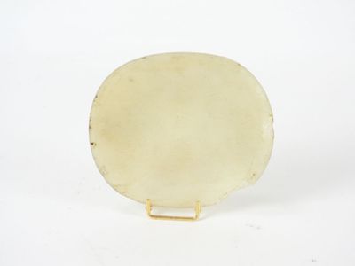 an image of a white plate on a stand on a white surface