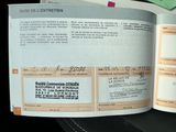 an open book with a bunch of papers on it