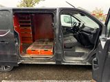 a van with a bed inside of it parked in a parking lot