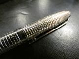 a pen that is laying on top of a table