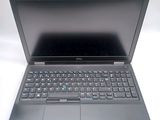 an open laptop computer sitting on top of a white table