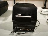 an image of a computer with a printer on top of it