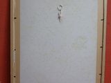 une photo d'un tableau accroché au mur