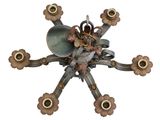 a clock that is made of metal and has a bird on it