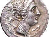 a close up of a coin with a woman ' s face on it