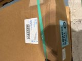 a brown box with a green ribbon on top of it