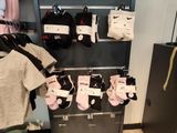 many pairs of socks hanging on a rack in a store