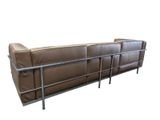 brown leather sofa with metal frame on white background with white background