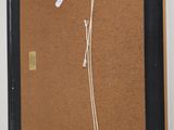 a picture of a cork board hanging on the wall