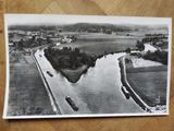a black and white photo of a boat on the water
