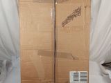two boxes that are sitting on a white sheet