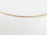 a gold chain necklace with a small bead on a mannequin mannequin mannequin mann