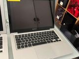 two laptops sitting on a table in a store