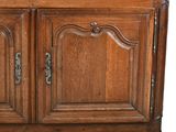 a wooden cabinet with two doors and two drawers
