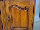 a wooden cabinet with a marble top on a table