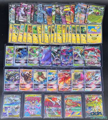 a large collection of pokemon cards are displayed on a table
