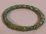 a bracelet that has been made out of green stone