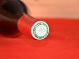 a close up of a bottle of wine on a table