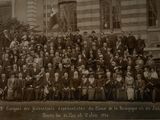an old photo of a group of people in front of a building