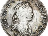 a silver coin with an image of a woman on it