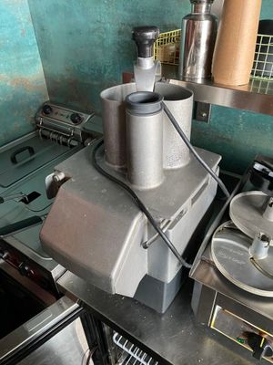 a blender sitting on top of a counter in a kitchen