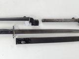 three different types of knives are displayed on a white surface