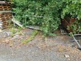 a pile of wood that has been left on the side of the road