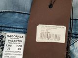 the back of a pair of blue jeans with a tag on it