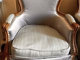 two chairs that are sitting next to each other in a room