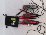 three electrical tools are laying on a white surface with a black bag
