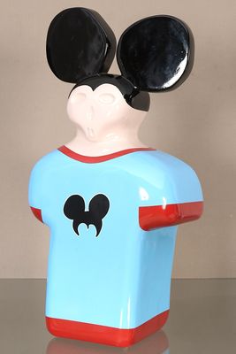 a mickey mouse figurine that is on a table