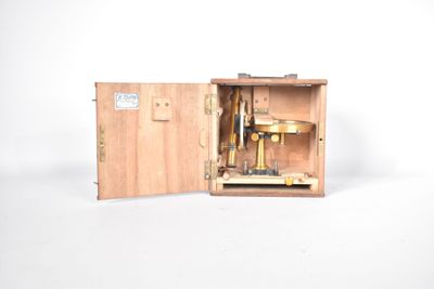 a small wooden box with a machine inside of it