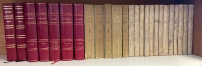 many books that are on a shelf in a book case
