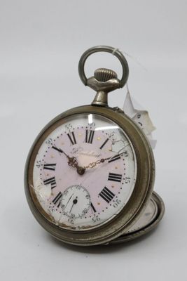 a silver pocket watch with roman numerals on it
