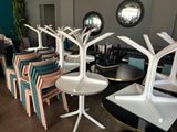 many chairs and tables that are arranged in a room
