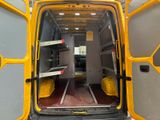 a yellow van that is open with the door open