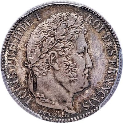 a close up of a coin on a white background
