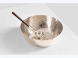 a close up of a metal bowl with a spoon in it