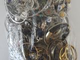 a bag full of assorted jewelry on a table
