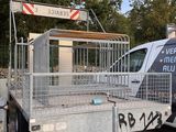 a truck that is parked next to a fence
