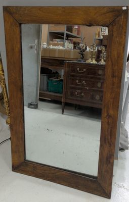 a mirror that is sitting on the floor in a room