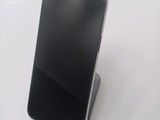 a cell phone that is sitting on top of a stand