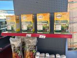 many bags of food on the shelf in the store
